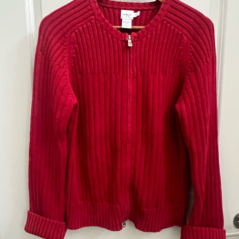 Red Calvin Klein Jean sweater with two way zipper ability to roll cuffs